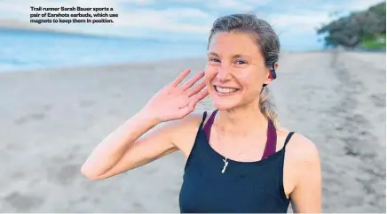 ?? ?? Trail runner Sarah Bauer sports a pair of Earshots earbuds, which use magnets to keep them in position.