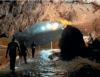  ?? AP ?? This photo tweeted by Elon Musk shows efforts underway to rescue trapped members of a youth soccer team from a flooded cave in northern Thailand.
