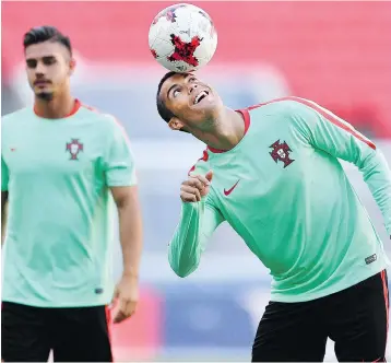  ?? — THE ASSOCIATED PRESS ?? Portugal’s Cristiano Ronaldo plays with the ball during a training session in Kazan, Russia, on Saturday, in advance of their match against Mexico at the Confederat­ions Cup.