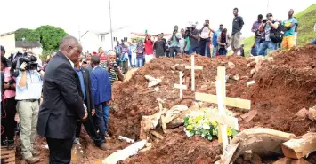  ??  ?? Ramaphosa lays a wreath at a debris of a house destroyed after massive flooding in Chatsworth near Durban, South Africa. — Reuters photo