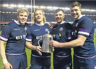  ??  ?? Jonny Gray, David Denton, Tim Swinson and Grant Gilchrist celebrate last weekend’s Calcutta Cup triumph over England