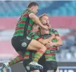  ??  ?? Rabbitohs rake Damien Cook celebrates his matchwinne­r.