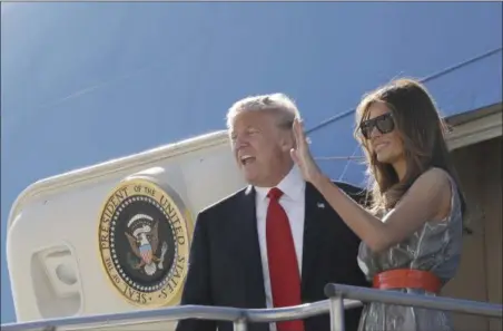  ?? EVAN VUCCI — THE ASSOCIATED PRESS ?? First lady Melania Trump waves as she and President Donald Trump board Air Force One in Hamburg, Germany, Saturday as they travel to Washington following the G20 Summit.