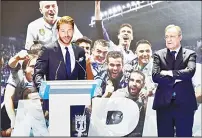  ??  ?? Real Madrid’s captain and defender Sergio Ramos delivers a speech next to Real Madrid President Florentino (right), at the Madrid Town hall on Plaza Cibeles in Madrid on May 22, during a celebratio­n after the team won the Spanish League football...