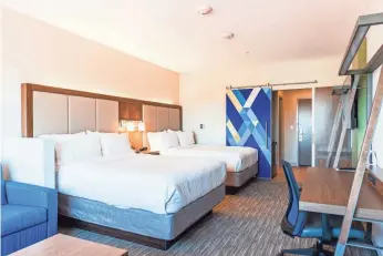  ?? DAN POMYKALSKI, INTERCONTI­NENTAL HOTELS GROUP ?? Rooms in select Holiday Inn Express hotels have sliding doors to separate the sleeping area from the entry and bathroom in order to promote sleep.