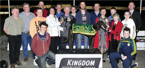  ??  ?? Left of Photo Jane Dowling presents the winning Trophy to Winning owner Michael Carmody (Tarbert) and right of photo Angela Dowling presents the perpetual Trophy to Nuala Carmody after Joyful Dribbler won the John & Mary Killeacle Dowling Memorial...