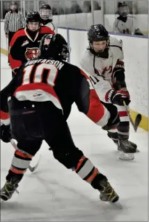  ?? Photo by Ryan Dahlman ?? HURRICANES NOT BLOWN OUT BUT... The Lethbridge Hurricanes didn’t reach the finals of the U15AA South Central Alberta Hockey League as they were dropped in two straight last weekend. Here in action forward Fynn Roesma tries to get past a a member of the South East Athletic Club action in Medicine Hat March 4. The Hurricanes dropped a 4-2 decision to the hometown Tigers and then were downed 3-2 by the Wheatland Warriors March 5 and then subsequent­ly out of the playoffs. The Taber Golden Suns had a best of three with Airdrie March 12-13 to decide the champion.