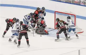  ?? Steve Musco/Yale Athletics ?? Northeaste­rn goaltender Gwyneth Phillips makes one of her 38 saves to earn a 4-1 victory over Yale on Saturday in New Haven.