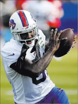  ?? Jaime Germano ?? The Associated Press Newly acquired Buffalo Bills receiver Anquan Boldin makes a catch during passing drills Tuesday at the team’s training camp in Pittsford, N.Y.