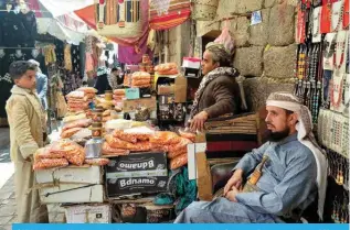  ?? ?? SANAA, Yemen: Merchants wait for customers at the old market in Sanaa, on February 4, 2024. – AFP