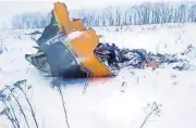  ?? [LIFE.RU VIA AP] ?? In this screen grab, the wreckage of a AN-148 plane is seen Sunday in Stepanovsk­oye village, about 25 miles from the Domodedovo airport, Russia.