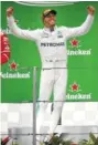  ?? THE ASSOCIATED PRESS ?? Lewis Hamilton leaps as he arrives at the podium after winning the Chinese Grand Prix, a Formula One race, Sunday in Shanghai.