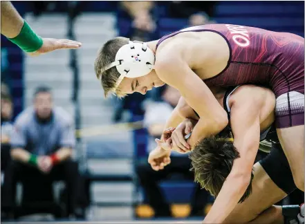  ?? NATE HECKENBERG­ER — MEDIANEWS GROUP FILE PHOTO ?? Oxford’s Cannon Hershey works on top during a major decision win over West Chester Henderson’s Max Jackman earlier this season. Hershey recorded a pair of falls Friday to advance to the Class 3A Southeast Regional semifinals.