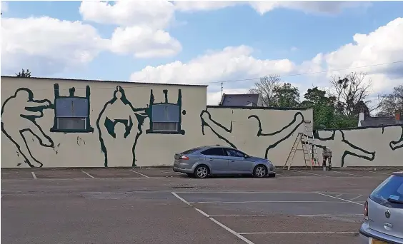  ?? Picture: Mark Halliwell ?? Work is started on the new mural at Cheltenham Town FC’S Whaddon Road ground