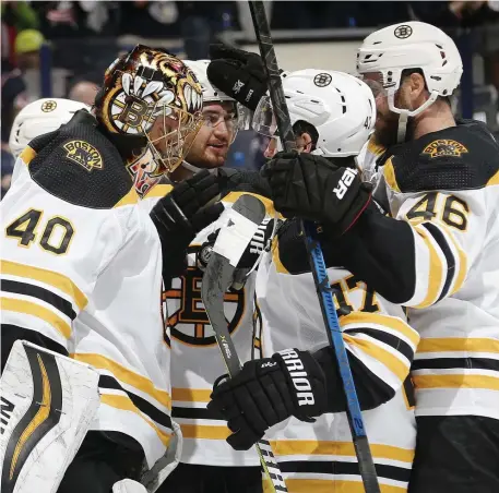  ?? COLUMBUS DISPATCH ?? COMING TOGETHER: Tuukka Rask (40) and Bruins teammates celebrate after their 4-1 victory against the Blue Jackets in last night’s Game 4 in Columbus, Ohio.