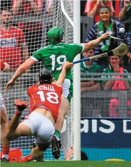  ?? RAY McMANUS & RAMSEY CARDY/SPORTSFILE ?? Limerick’s Shane Dowling (above and below) attempts to strike the sliotar as he is fouled in the square by Cork’s Mark Ellis. Dowling scored his side’s second goal from the resultant penalty