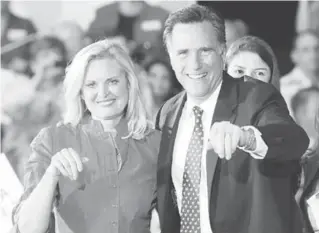  ?? AFP PHOTO ?? Republican White House hopeful Mitt Romney and wife Ann celebrate during a primary election night event in Tampa, Florida, on Tuesday ( Wednesday in Manila).