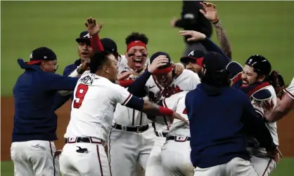  ?? ?? The Atlanta Braves celebrate defeating the Los Angeles Dodgers in Game 6 of the NLCS. Photograph: Branden Camp/EPA