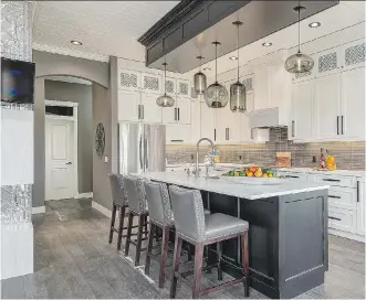  ?? PHOTOS: CHBA- CALGARY REGION ?? The free RenoMark Renovation and Infill Tour takes place Saturday, featuring eight transforme­d homes and two new infills. This is a renovated kitchen by Kon-strux Developmen­ts Inc.