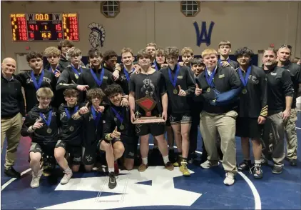  ?? BRIAN RIPPEY — SPECIAL TO THE READING EAGLE ?? The Berks Catholic wrestling team gathers with the trophy after winning the BCIAA team championsh­ip.