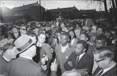  ?? Associated Press file photo ?? Wilson Baker, left foreground, public safety director, warns of the dangers of night demonstrat­ions at the start of a march in Selma, Ala. Second from right foreground is John Lewis of the Student Non-Violent Committee. Lewis, who carried the struggle against racial discrimina­tion from Southern battlegrou­nds of the 1960s to the halls of Congress, died Friday.