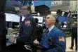  ?? RICHARD DREW — THE ASSOCIATED PRESS ?? Specialist Gregg Maloney, left, and trader Timothy Nick work on the floor of the New York Stock Exchange, Wednesday.