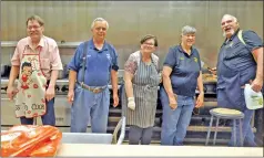  ?? ?? Earlier this year, the Elks Lodge hosted a a chicken fried steak dinner in honor of the Bishop Union High School junior varsity basketball team. Helping out in the kitchen are Elks members Chad Cathey, Mike Barlow, Jessica Cathey, Bonnie and Don Binns.