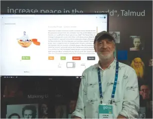  ?? (Jeremy Sharon) ?? PEOPLE’S TALMUD creator Gedaliah Gurfein spreads the word at the Jewish Federation­s of North America General Assembly this week.