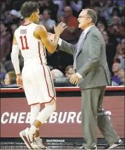  ?? GARETT FISBECK — THE ASSOCIATED PRESS ?? Oklahoma coach Lon Kruger encourages guard Trae Young during the first half of the Sooners’ game against Kansas.