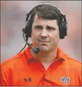  ??  ?? COORDINATI­NG CAROUSEL: Auburn defensive coordinato­r Will Muschamp walks around the field during the first quarter of the Tigers’ spring game April 18 in Auburn, Ala. The Southeaste­rn Conference will have 14 new coordinato­rs this season. In typical SEC...