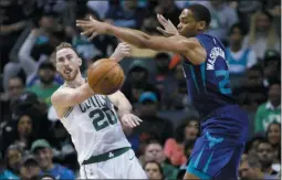  ?? BOB LEVERONE ?? Boston Celtics’ Gordon Hayward (20) gets a pass off against Charlotte Hornets’ P.J. Washington (25) during the second half of an NBA basketball game in Charlotte, N.C., Thursday, Nov. 7, 2019.