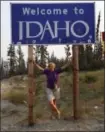  ?? ELON HARPAZ VIA AP ?? Travel Editor Beth Harpaz standing beneath a “Welcome to Idaho” sign near Gibbonsvil­le, Idaho, and the Montana border. Idaho was Harpaz’s final destinatio­n on a quest to visit all 50 states.