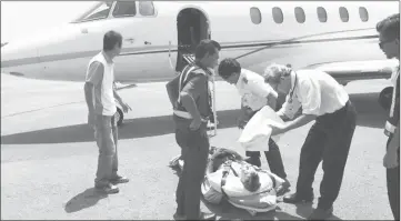  ??  ?? A patient is brought to hospital by an air ambulance service.