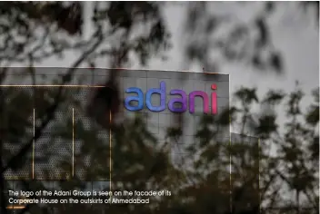  ?? ?? The logo of the Adani Group is seen on the facade of its Corporate House on the outskirts of Ahmedabad