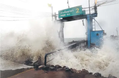  ??  ?? Waves due to Pabuk crash into a pier in the southern Thai province of Surat Thani. — AFP photo