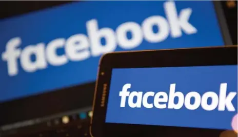  ?? JUSTIN TALLIS/AFP/GETTY IMAGES ?? Nearly one in five users say they are using Facebook less than they did a year ago, according to a new poll of 1,000 people by Honest Data.