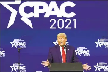  ?? John Raoux Associated Press ?? SPEAKING SUNDAY at the Conservati­ve Political Action Conference in Orlando, Fla., former President Trump vowed to raise campaign money to unseat the 17 Republican­s who voted to impeach or convict him.