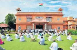  ?? PTI ?? Congress MLAs supporting Rajasthan CM Ashok Gehlot stage a sit-in protest at the Raj Bhavan in Jaipur, demanding governor Kalraj Mishra convene an urgent assembly session, on Friday. >>P6