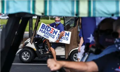  ?? Photograph: Chandan Khanna/AFP/Getty Images ?? A Biden supporter in The Villages, a once near-exclusive Republican preserve north of Orlando. Other Floridian enclaves of retirees have become noticeably more blue.