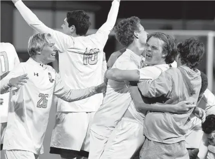  ?? KEN KOONS/BALTIMORE SUN MEDIA GROUP ?? C. Milton Wright celebrates its state championsh­ip win after a shootout over Great Mills at Loyola Maryland’s Ridley Athletic Complex.