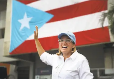  ?? Joe Raedle / Getty Images ?? San Juan Mayor Carmen Yulin Cruz briefs the media on recovery efforts at a temporary government operations center set up at Roberto Clemente Stadium in the aftermath of Hurricane Maria.