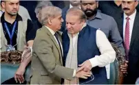  ?? AFP ?? Shahbaz Sharif embraces his brother Nawaz Sharif after being elected president of the ruling Pakistan Muslim League (Nawaz) at the General Workers Council in Islamabad on Tuesday. —