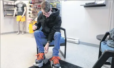  ?? GLEN WHIFFEN/THE TELEGRAM ?? Ryan Quilty, 20, is all smiles as he checks out his skates with special supports attached at Atlantic Pro Sports in Paradise on Monday.