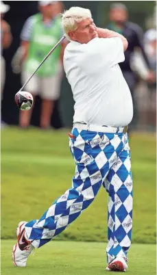  ??  ?? John Daly, hitting a tee shot in the 2015 PGA Championsh­ip, tends to draw a crowd with his wardrobe and aggressive style.
BRIAN SPURLOCK, USA TODAY SPORTS