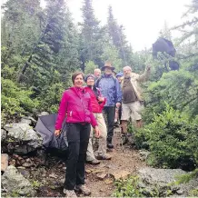  ?? COLETTE DERWORIZ/ CALGARY HERALD ?? Marisa Grassi, the great niece of Lawrence Grassi, and a delegation from Falmenta, Italy, where he was born, hike the Lake Oesa trail, a trail built by Lawrence Grassi.