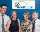  ??  ?? New owners: Paul and Emily Penhearow (left) are taking over the In2Learnin­g Remuera centre, with previous owners Tom and Margaret Eades (right) preparing for their well-deserved retirement in Tauranga.