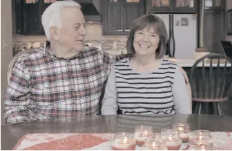  ??  ?? Rick and Nina Schlidt at their home in Hartland, Wisconsin. Nina Schlidt had CML diagnosed in 2009 and had to take drugs to control it for six years. Quitting the drugs, she said, was wonderful and “financiall­y, a godsend.”