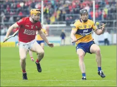  ?? (Pic: George Hatchell) ?? Cork’s Niall O’Leary prepares to challenge Clare’s Tony Kelly in the Munster SHC at FBD Semple Stadium, Thurles.