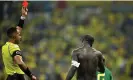  ?? Photograph: Dylan Martinez/Reuters ?? Aboubakar is shown a red card by the referee Ismail Elfath.