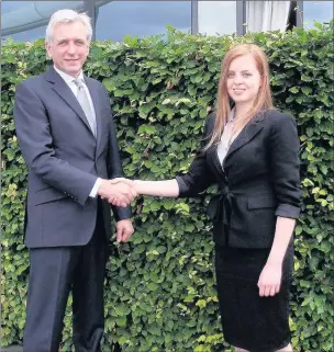  ??  ?? n TAKING OFF: Emily Smith is congratula­ted by Brandon O’Reilly, chief executive of TAG Farnboroug­h Airport, after being named the recipient of the TAG Flying Scholarshi­p 2016